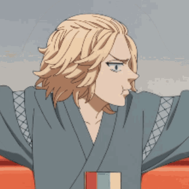 a man in a kimono is standing with his arms outstretched