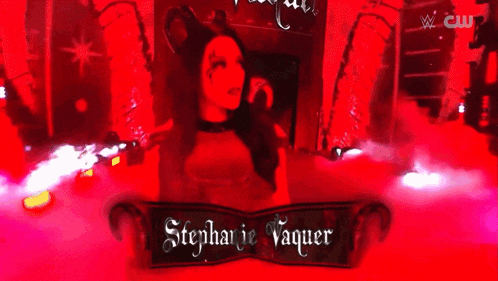 stephanie vaquer is a female wrestler in a red and black costume