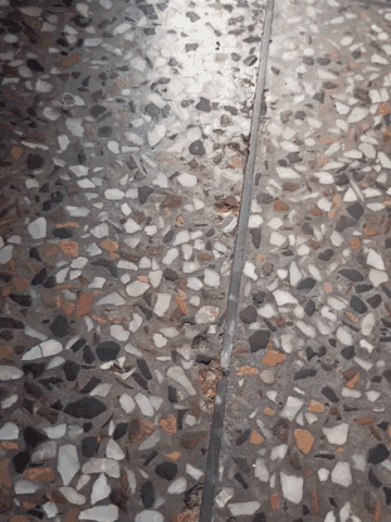 a close up of a wall with a lot of small rocks
