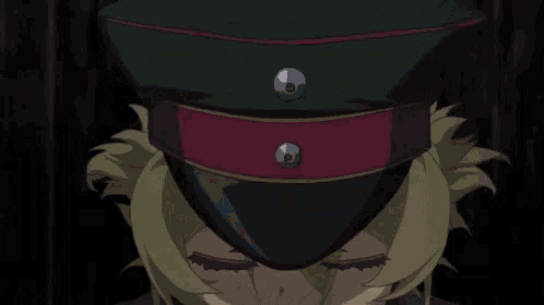 a close up of a person 's face with blue eyes and a hat