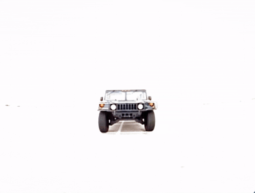 a jeep is parked on a gravel road