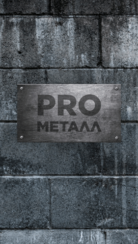a brick wall with a metal sign that says pro metala