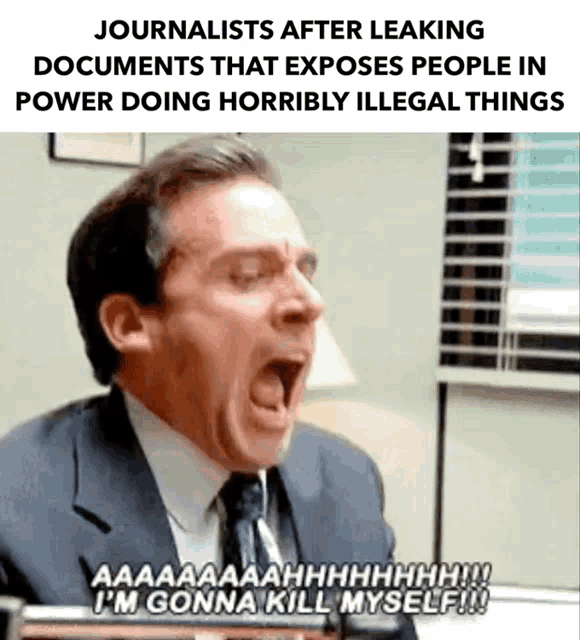 a man in a suit and tie is screaming with his mouth wide open .