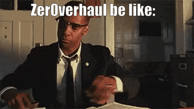 a man in a suit and tie is sitting at a desk with the words zeroverhaul be like .