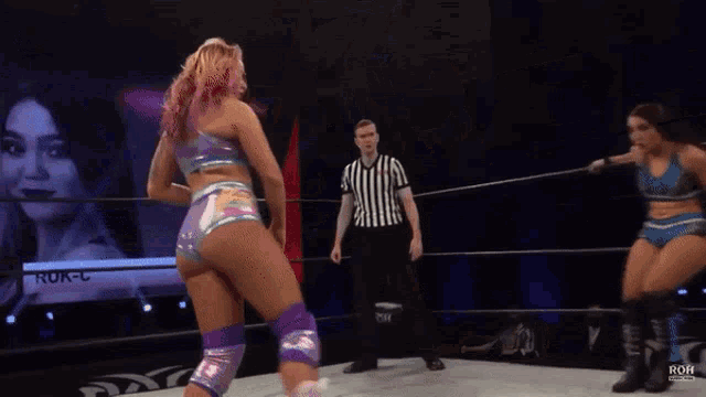 two women are wrestling in a ring with the word roh on the bottom right