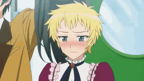 a girl with blonde hair and blue eyes is making a sad face