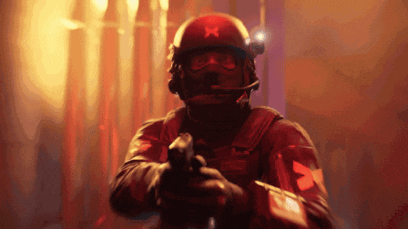 a soldier with a red helmet with a x on it is holding a gun