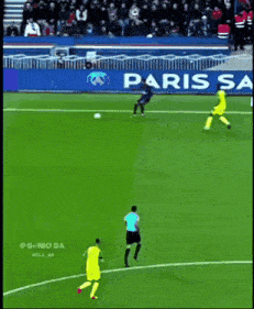 soccer players on a field with an ad for paris saint