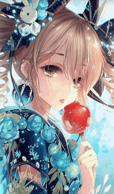 a girl is holding a red lollipop in her hand