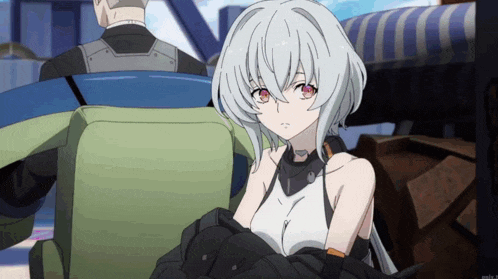 a girl with white hair and red eyes is sitting next to a man in a green chair
