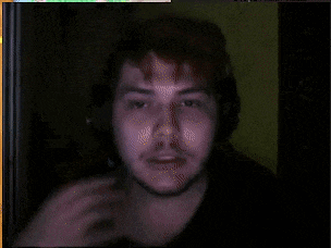a blurry picture of a man with a beard