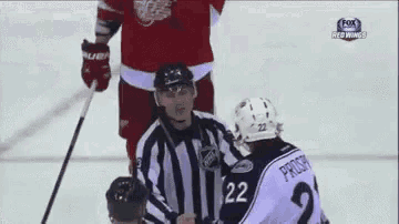 a hockey player with the number 22 on the back of his jersey