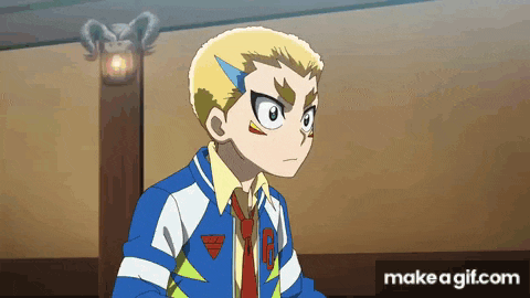 a boy in a blue jacket and tie is standing in a room with a lamp on the wall .