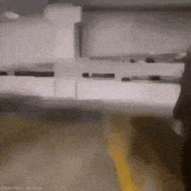 a blurry photo of a person walking down a street