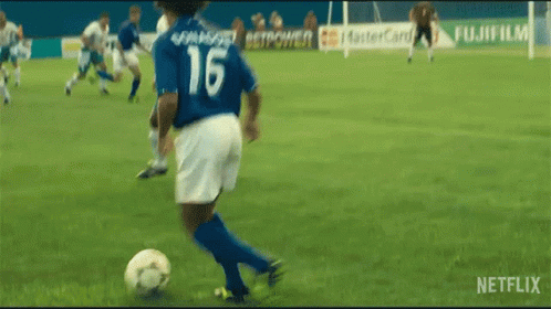 Passing Baggio The Divine Ponytail GIF - Passing Baggio The Divine Ponytail Kicking The Ball GIFs