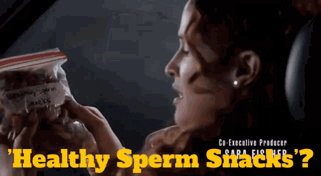 a woman holds a bag of healthy sperm snacks
