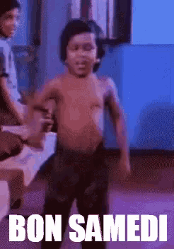 a shirtless child is dancing in a room with the words bon samedi on the bottom