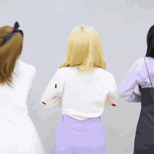 three girls are standing next to each other with the letters oio on the bottom