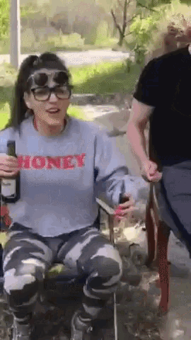 a woman wearing a shirt that says honey on it
