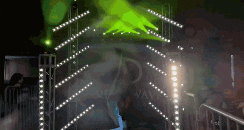 a green light is shining on a sign that says ' wave '