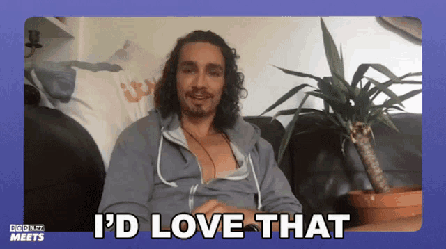 a man sitting on a couch with the words i 'd love that written on the bottom