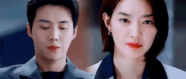 a man and a woman are looking at each other . the woman has red lipstick on her lips .