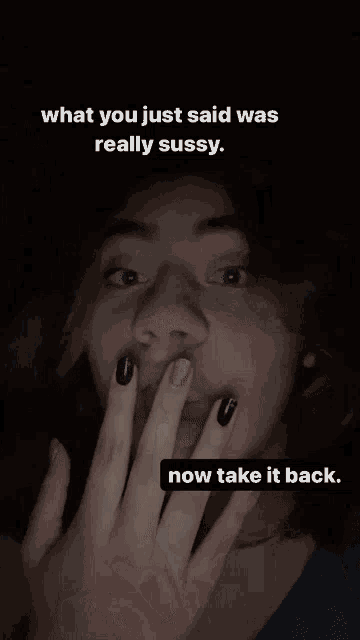 a woman covering her face with her hands with a caption that says " what you just said was really sussy now take it back "