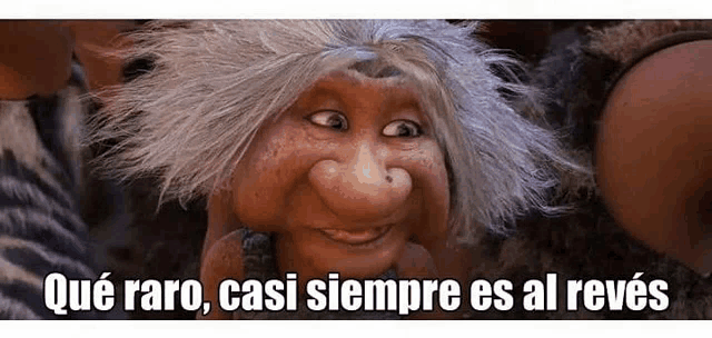a cartoon character with gray hair and a big nose is smiling and looking at the camera .