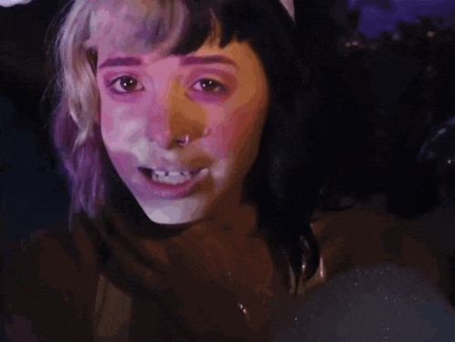 a close up of a woman 's face with a lot of white powder on it