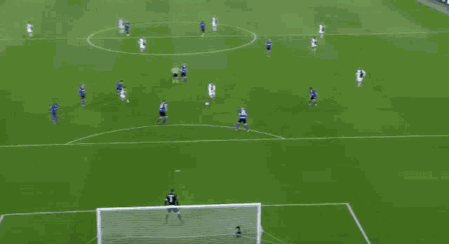 a soccer player is jumping in the air to score a goal during a soccer game .