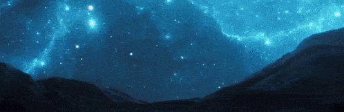 a night sky with mountains in the foreground and lots of stars