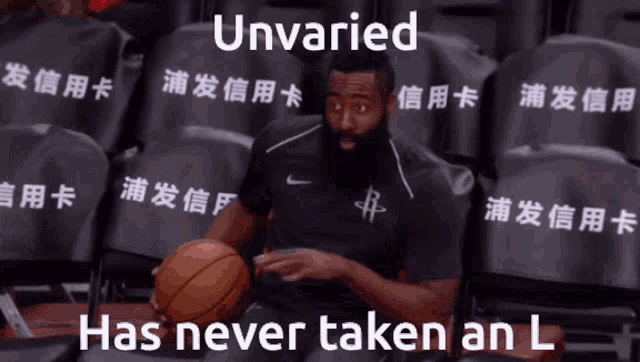 a man holding a basketball in front of empty seats with the words unvaried has never taken an l below him