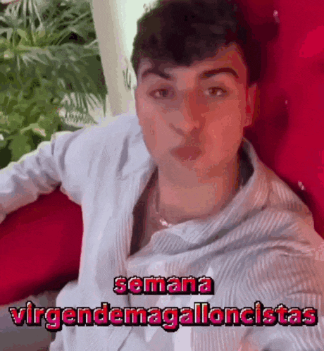a young man is blowing a kiss with the words semana virgendemagalloncistas written above him
