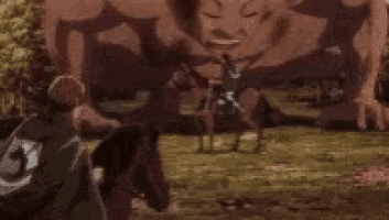 a giant monster is eating a cow in a field in a cartoon .