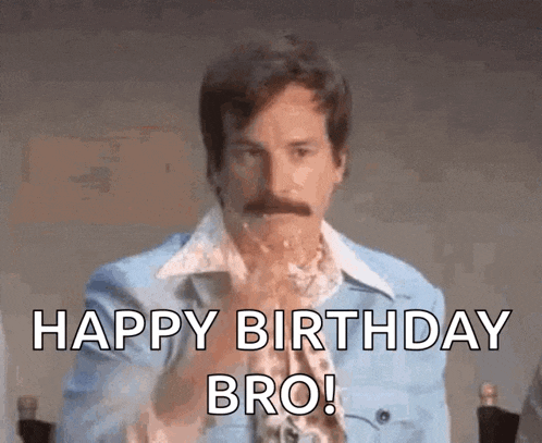 a man with a mustache is wearing a blue jacket and eating a piece of cake .