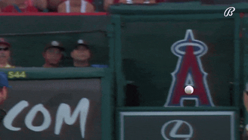 a baseball player is swinging his bat in front of a lexus sign