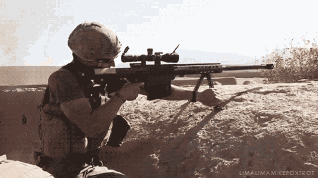 a man is holding a sniper rifle in the desert and the name limalima mike foxtrot is on the bottom