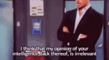 a man in a suit with his arms crossed says i think that my opinion of your intelligence lack thereof is irrelevant