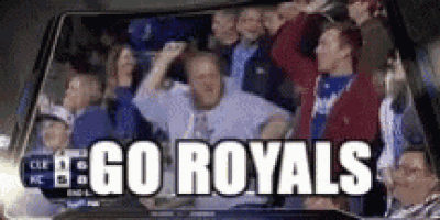 a group of people are watching a game and they are cheering for the royals