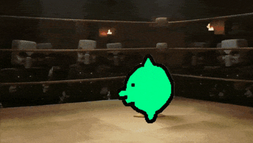 a boxing ring with a green cartoon character in the middle