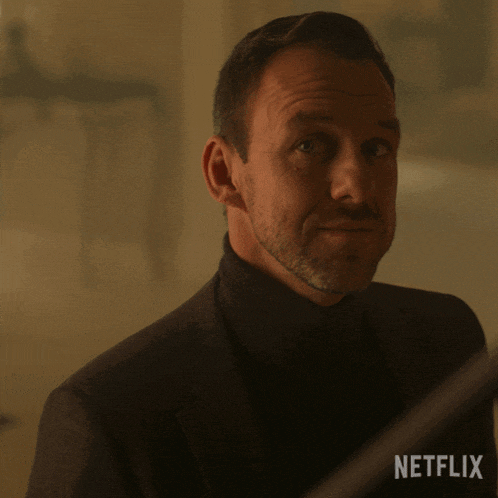 a man 's face is shown with a netflix logo in the background