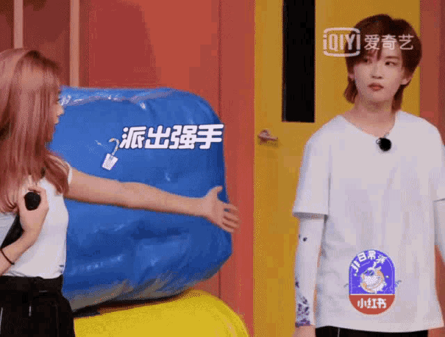 a woman in a white shirt with a sticker on her arm that says ' ioiyi '