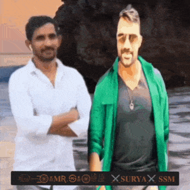 two men standing next to each other with a sign that says surya x ssm on it