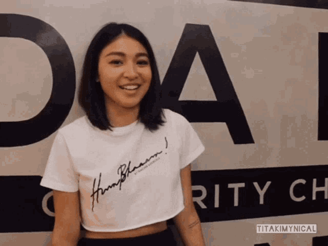 a woman wearing a white shirt that says humphreys