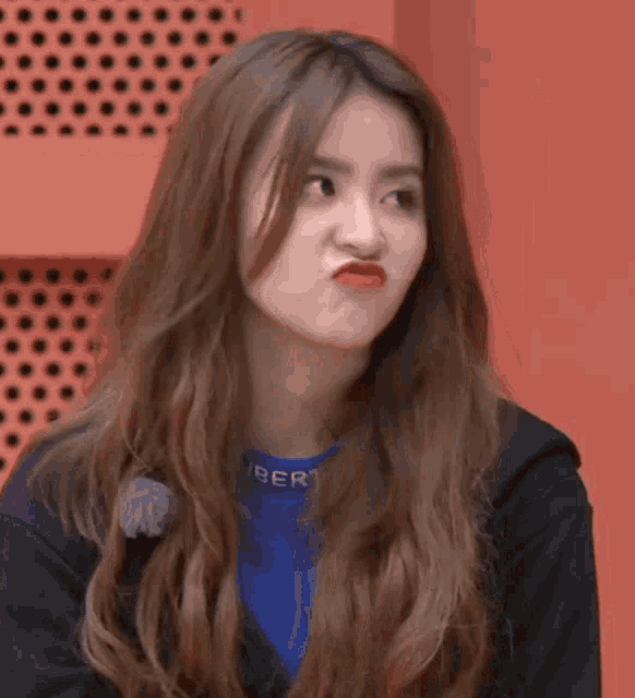 a close up of a woman making a funny face