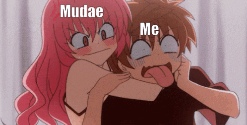 a girl with pink hair is holding a boy with his tongue hanging out and the words mudae me are above them