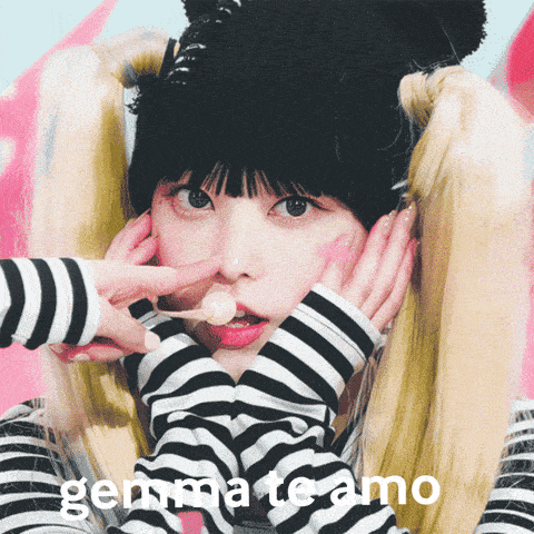 a girl wearing a striped shirt and a black hat says gemmate amo on the bottom