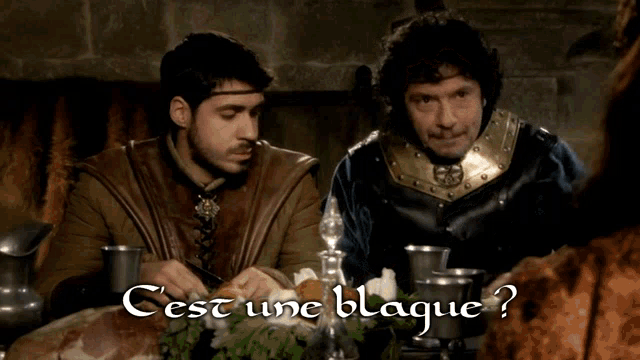 two men sit at a table with the words cest une blague