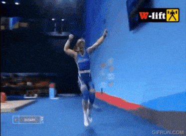 a man is jumping in the air in front of a w-lift logo