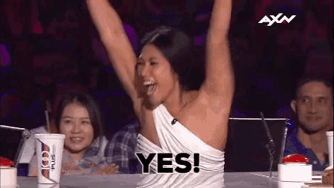 a woman in a white dress with her arms in the air and the word yes above her